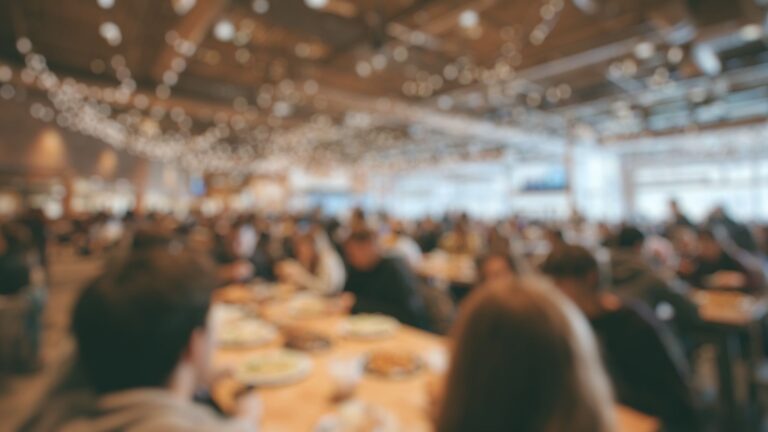 busy dining hall, people eating together